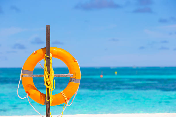 istock Lifebuoy ring on tropical white beach 479088106