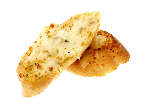 a DSLR royalty free image of two thick slices of garlic flavoured bread baked in the oven isolated against a white background