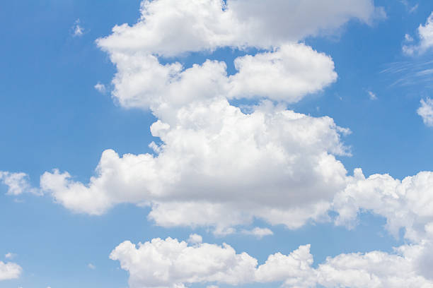 istock blue sky with cloud closeup and bright sun 479089860
