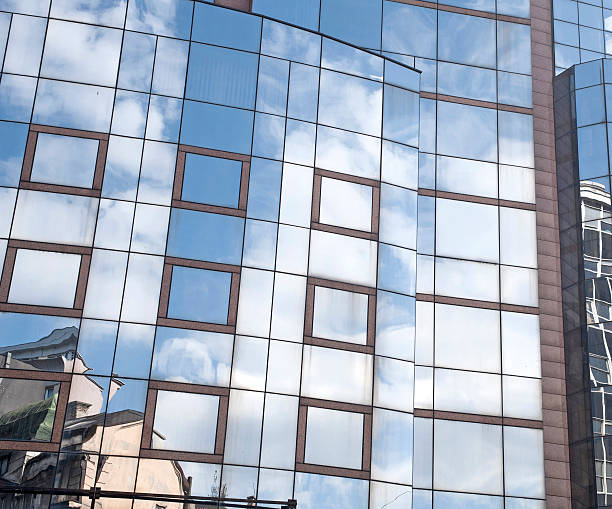 istock sky line reflection in modern glass bulding 479090952