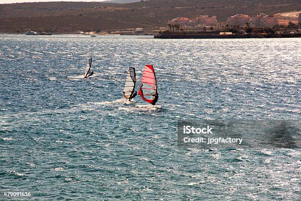 Three Wind Surfers On The Sea Stock Photo - Download Image Now - 2015, Activity, Adventure