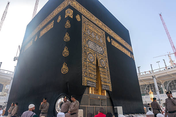 Kaaba Mecca, Saudi Arabia - March 14, 2015: Muslims look into Maqam Ibrahim (the station of Ibrahim)  in Makkah, Saudi Arabia. Inside the Maqam Ibrahim is a stone block where Ibrahim stood to build the kaaba. muhammad prophet photos stock pictures, royalty-free photos & images