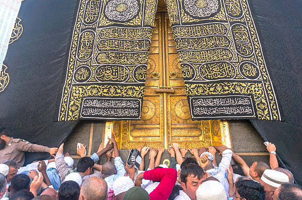 Kaaba Mecca, Saudi Arabia - March 14, 2015: A close up view of kaaba door and the kiswah (cloth that covers the kaaba) at Masjidil Haram in Makkah, Saudi Arabia. The door is made of pure gold. muhammad prophet photos stock pictures, royalty-free photos & images