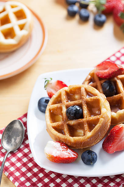 istock waffles with strawberry , blueberry and caramel sauce 479094802