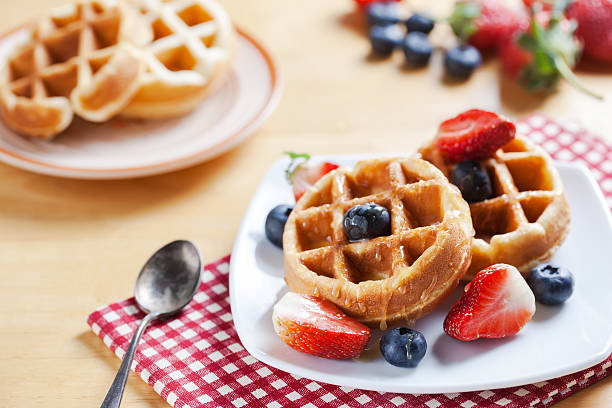 istock waffles with strawberry ,blueberry and caramel sauce 479094964