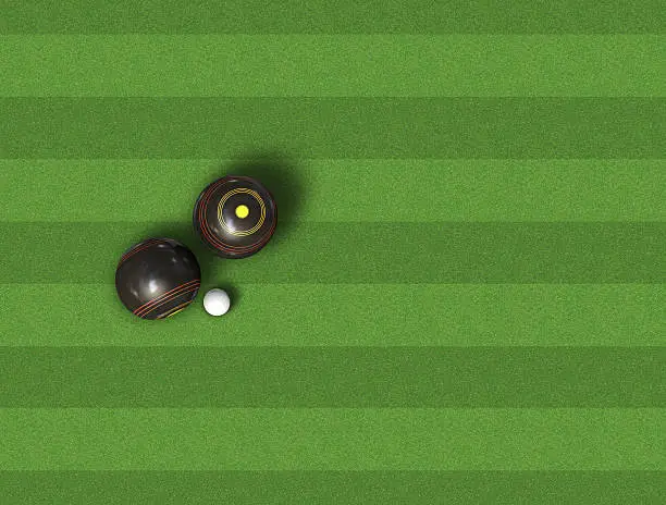 A top view of a set of wooden lawn bowls next to a jack on a perfect flat green lawn