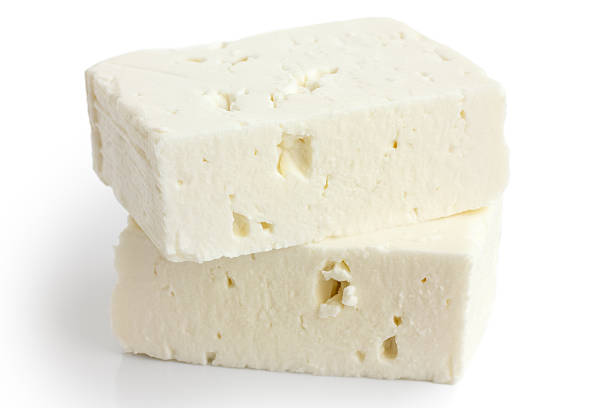 istock Greek feta cheese block isolated on white. 479095960
