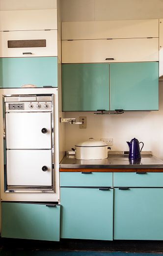 Domestic blue Kitchen with kitchen utensilâs  built and designed in the 1960s