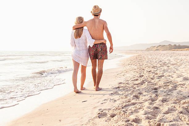 istock Loving couple walking on the beach 479100930