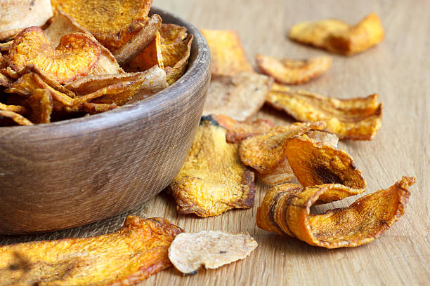 istock Fried carrot and parsnip chips in rustic wood bowl. 479101130