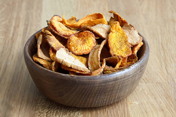 istock Fried carrot and parsnip chips in rustic wood bowl. 479101132