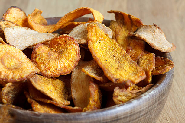 istock Fried carrot and parsnip chips in rustic wood bowl. 479101134