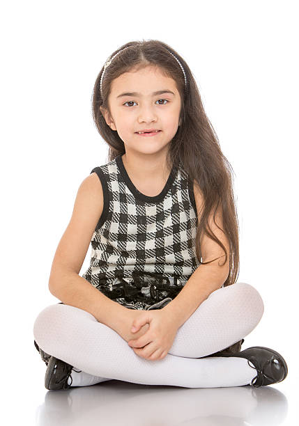 istock Charming dark-haired little girl sitting on the floor folded 479101288