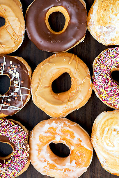 istock Glazed Doughnuts with colourful sprinkles, chocolate, icing 479101298