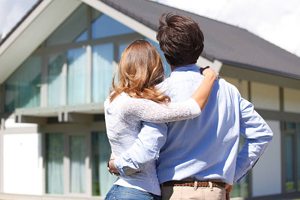 istock couple looking at house 479104760