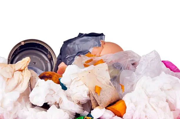 Trash can filled with rubbish and garbage, isolated on white