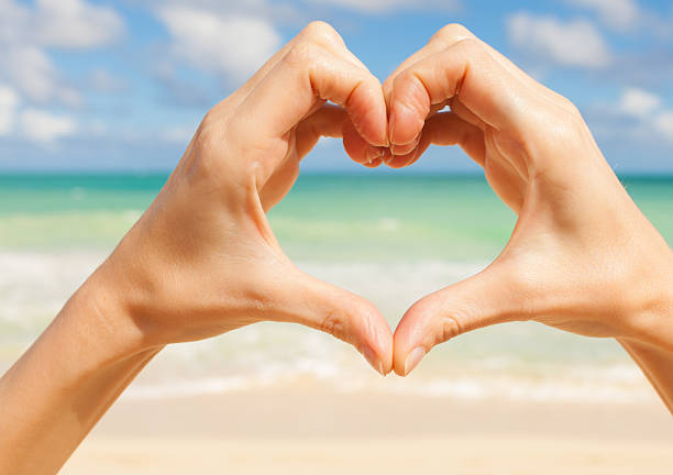 istock Heart shape hands against the beach 479105483