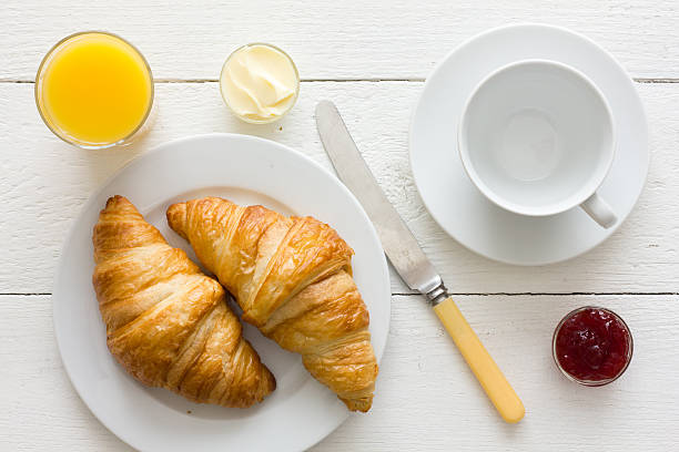 istock Coffee, orange juice and croissant breakfast. From above. 479109006