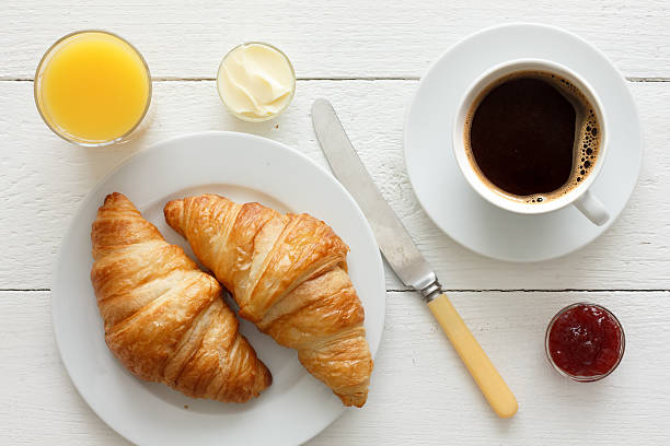 istock Coffee, orange juice and croissant breakfast. From above. 479109164