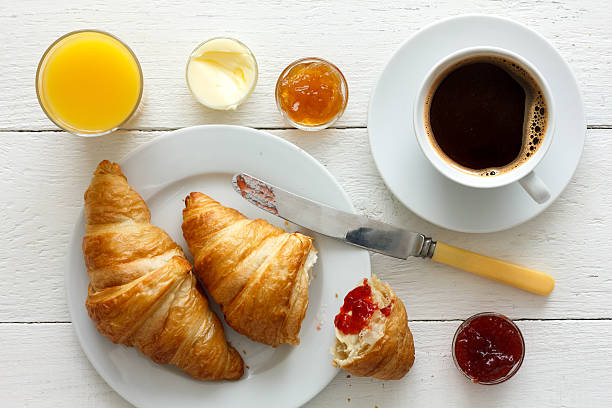 istock Coffee, orange juice and croissant breakfast. From above. 479109466