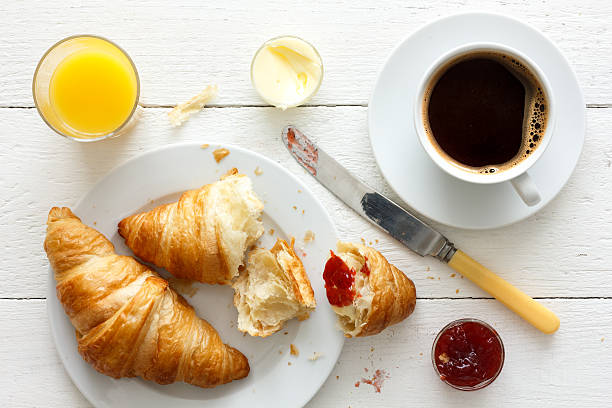 istock Coffee, orange juice and croissant breakfast. From above. 479109468