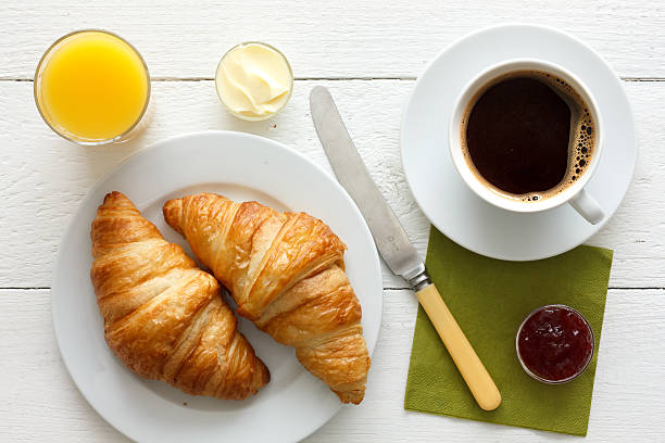 istock Coffee, orange juice and croissant breakfast. From above. 479109482
