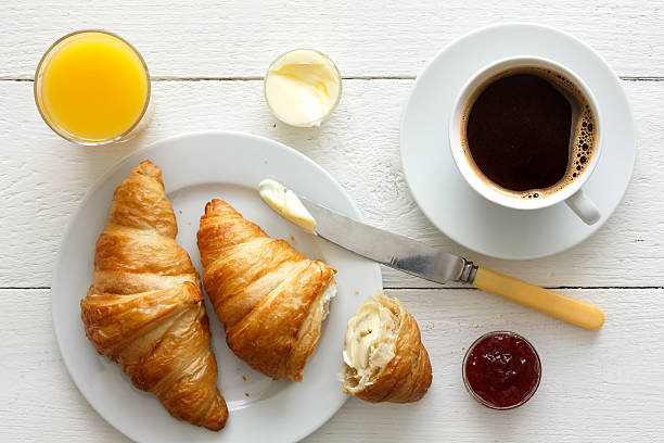 istock Coffee, orange juice and croissant breakfast. From above. 479109486