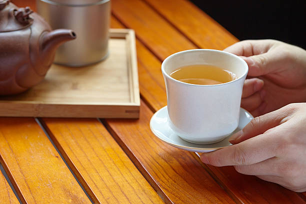 istock holding hot cup of tea 479113119