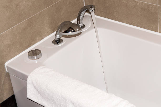 istock white bathtub in the bathroom with a towel 479115347
