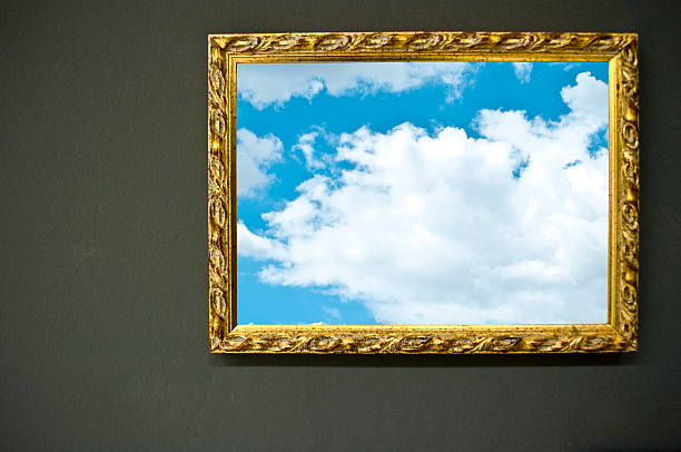 istock Antique empty golden frame on grunge wall with sky photograph 479116239
