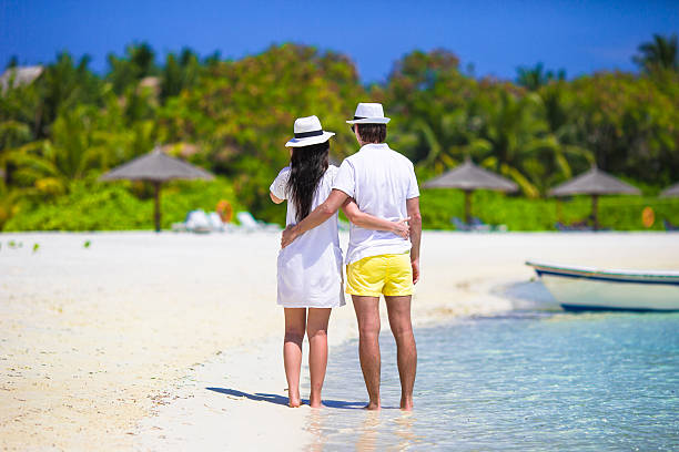 istock Young couple on white beach at summer vacation 479116240