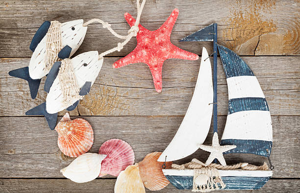 istock Toy sailboat and fish with seashells 479121117