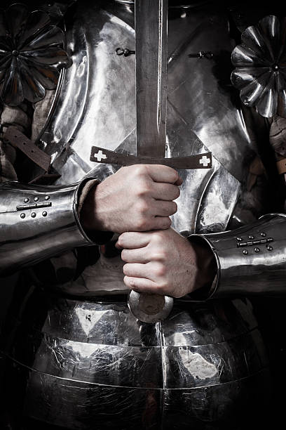 istock knight wearing armor and holding two-handed sword 479121836