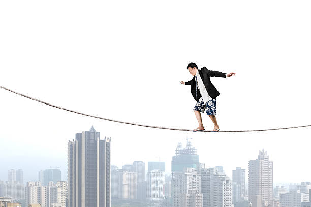 istock Balancing on rope with city view 479123099