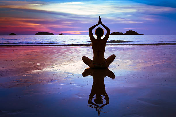 istock yoga on the beach 479123381