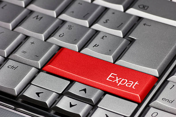 Computer Key - Expat Computer Key - Expat expatriate photos stock pictures, royalty-free photos & images