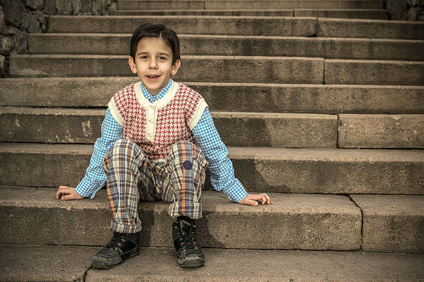 istock Child sitting on stairs 479125889