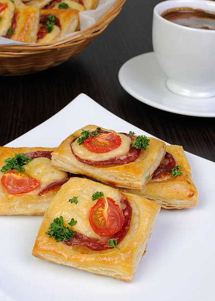 istock Appetizer of puff pastry with salami 479126736