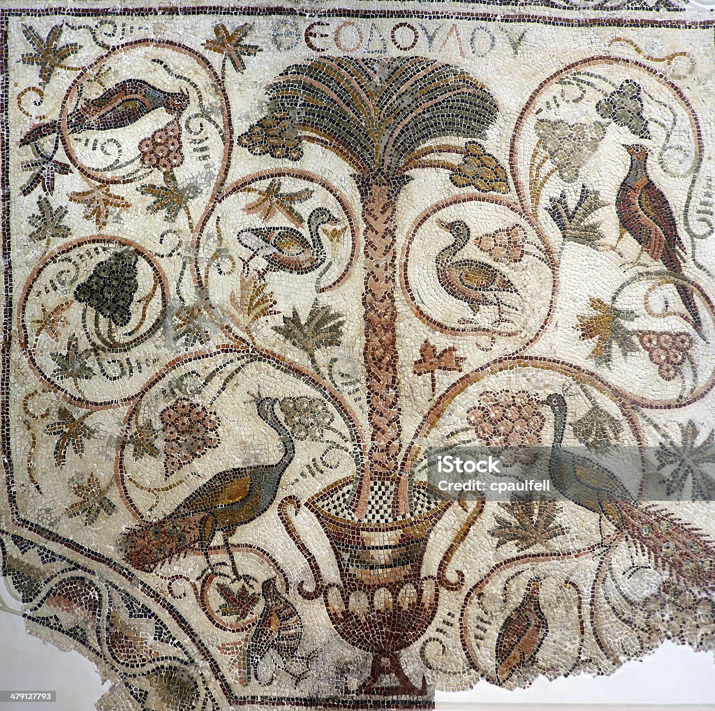 Palm tree and birds Beautiful ancient mosaic from the early Byzantine period depicting a palm tree and birds. Mosaic Stock Photo