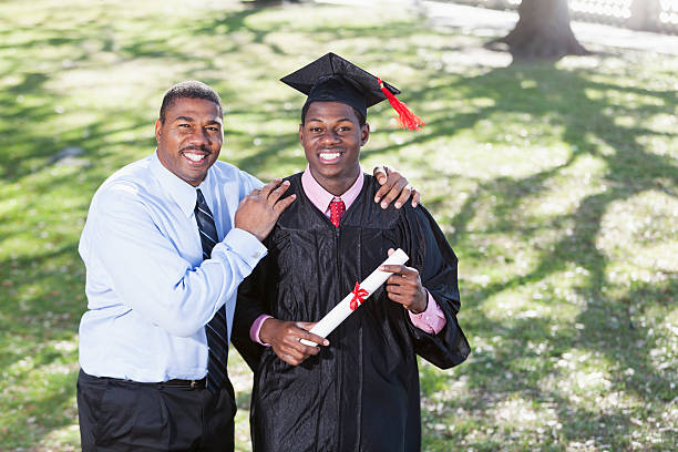 istock African American graduate with proud father. 479130121