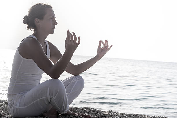 istock Meditating by the sea 479130319