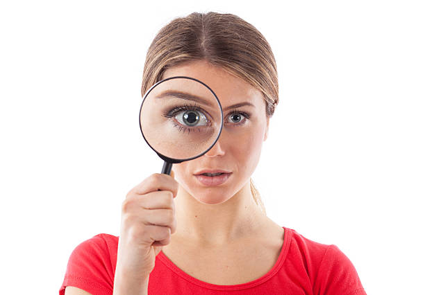 istock Girl holding a magnifying glass 479132483