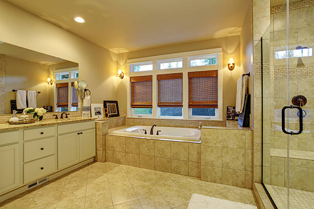 istock Large master bathroom with tile floor and tub. 479134284