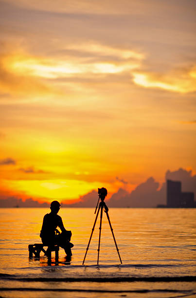 istock silhouette of  photographer 479135619