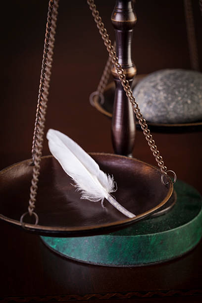 istock Feather on Scales of Justice 479141082