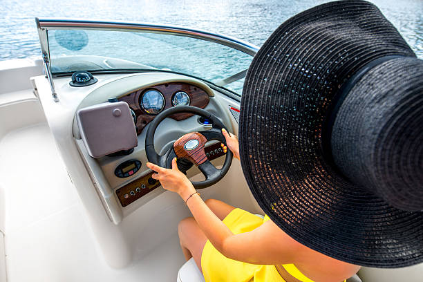 istock Woman driving yacht 479142348