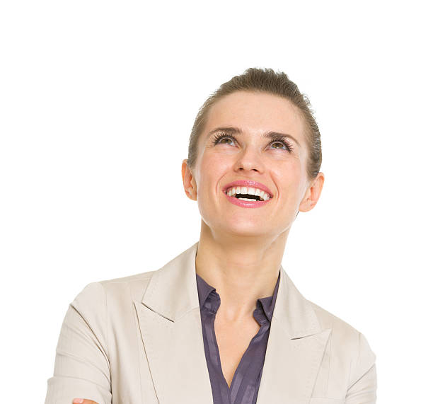 istock happy business woman looking up on copy space 479143621