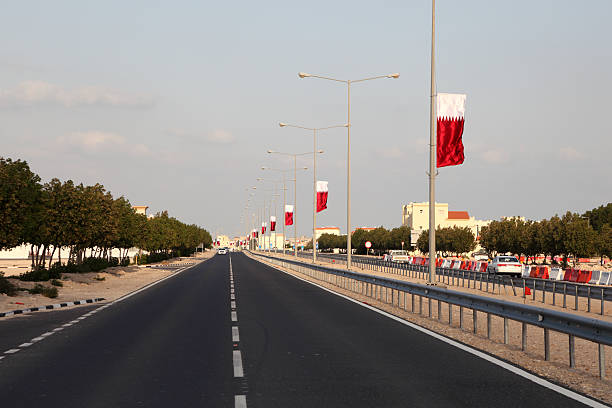 Street decorated with national flags in Al Khor, Qatar, Middle East