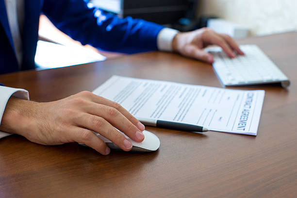 istock Male hand holding computer mouse with laptop keyboard 479146170