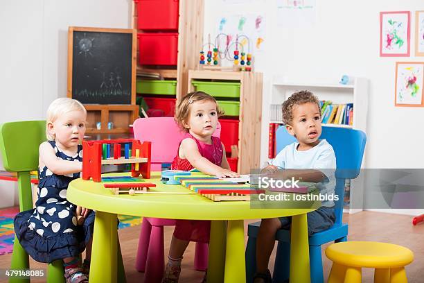 Group Of Toddlers Reading Playing With Xylophones Stock Photo - Download Image Now - 2-3 Years, Blond Hair, Book